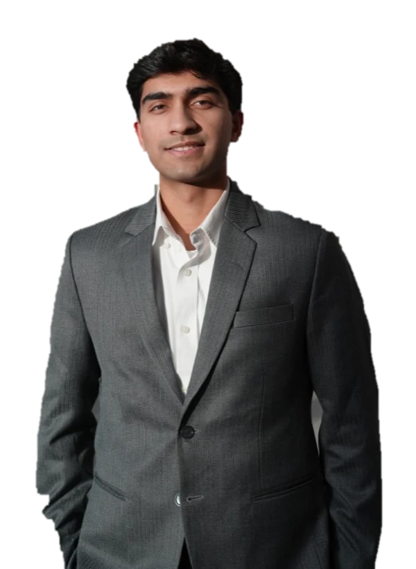 Portrait of Nihar Bagkar in a grey suit, smiling